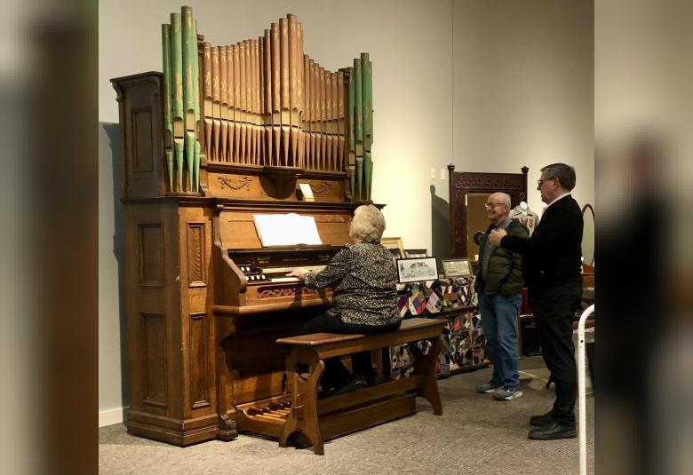 Krista Koschmeder plays the organ while Pat Machen and Denis Boerjan admire the sound. (Photos courtesy of Denis Boerjan)